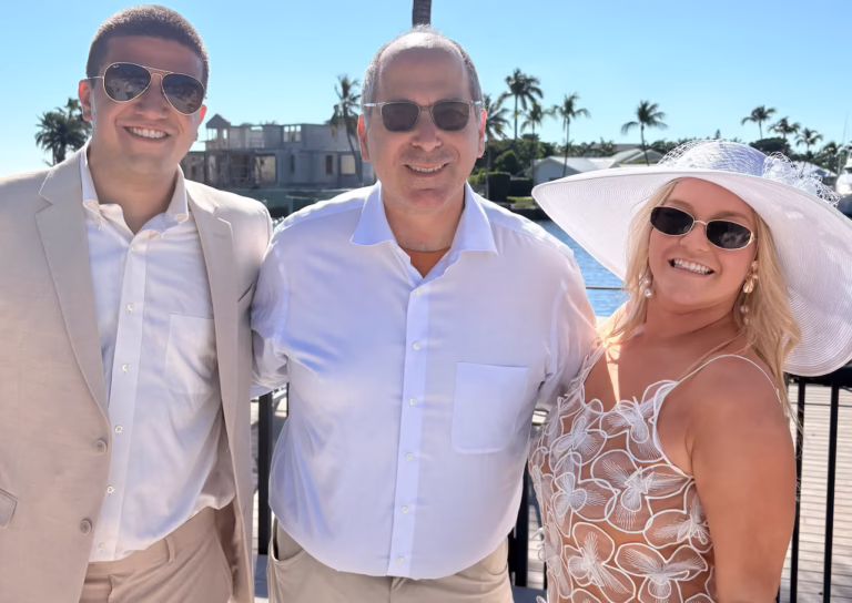 Rabbi Robert Nosanchuk with newlyweds Charles Rilli and Mollie Schulman.